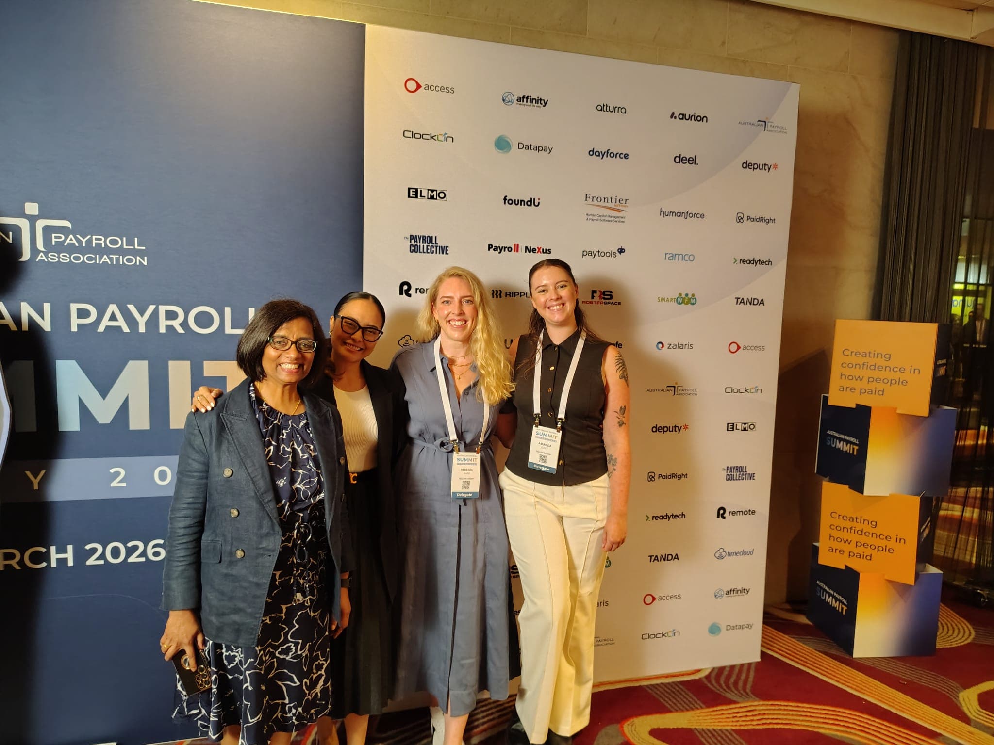 Four attendees together at the Australian Payroll Summit in Sydney